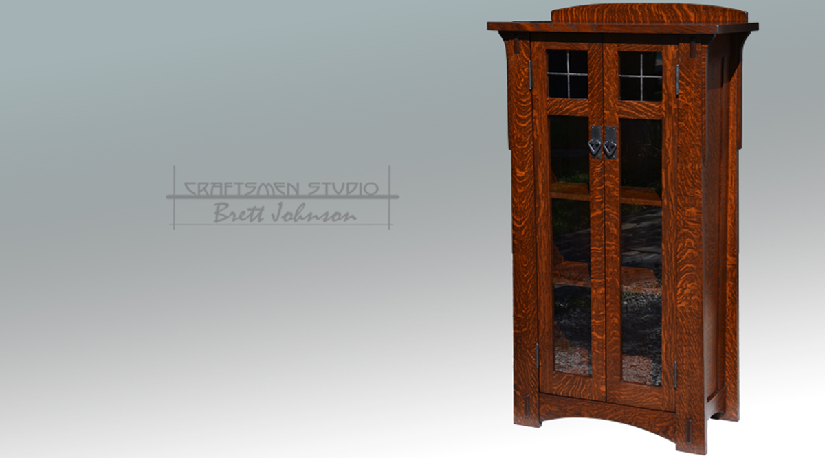Handcrafted Arts and Crafts bookcase door detail with leaded glass and handhammered copper hardware
