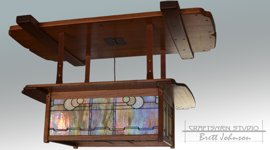 Greene and Greene chandelier reproduction featuring mahogany construction and hand-cut stained-glass panels by Craftsmen Studio.